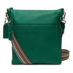 Consuela medium sized crossbody in bold green teal leather with zipper top and braided strap.