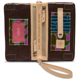 Chocolate-toned glitter Consuela wallet with two zippered compartments, an exterior pocket, six card slots, and an ID window with double magnetic closure,  included adjustable woven strap for crossbody carry or a detachable wristlet