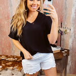 Lightweight and flowy black V neck dolman style short sleeved top.