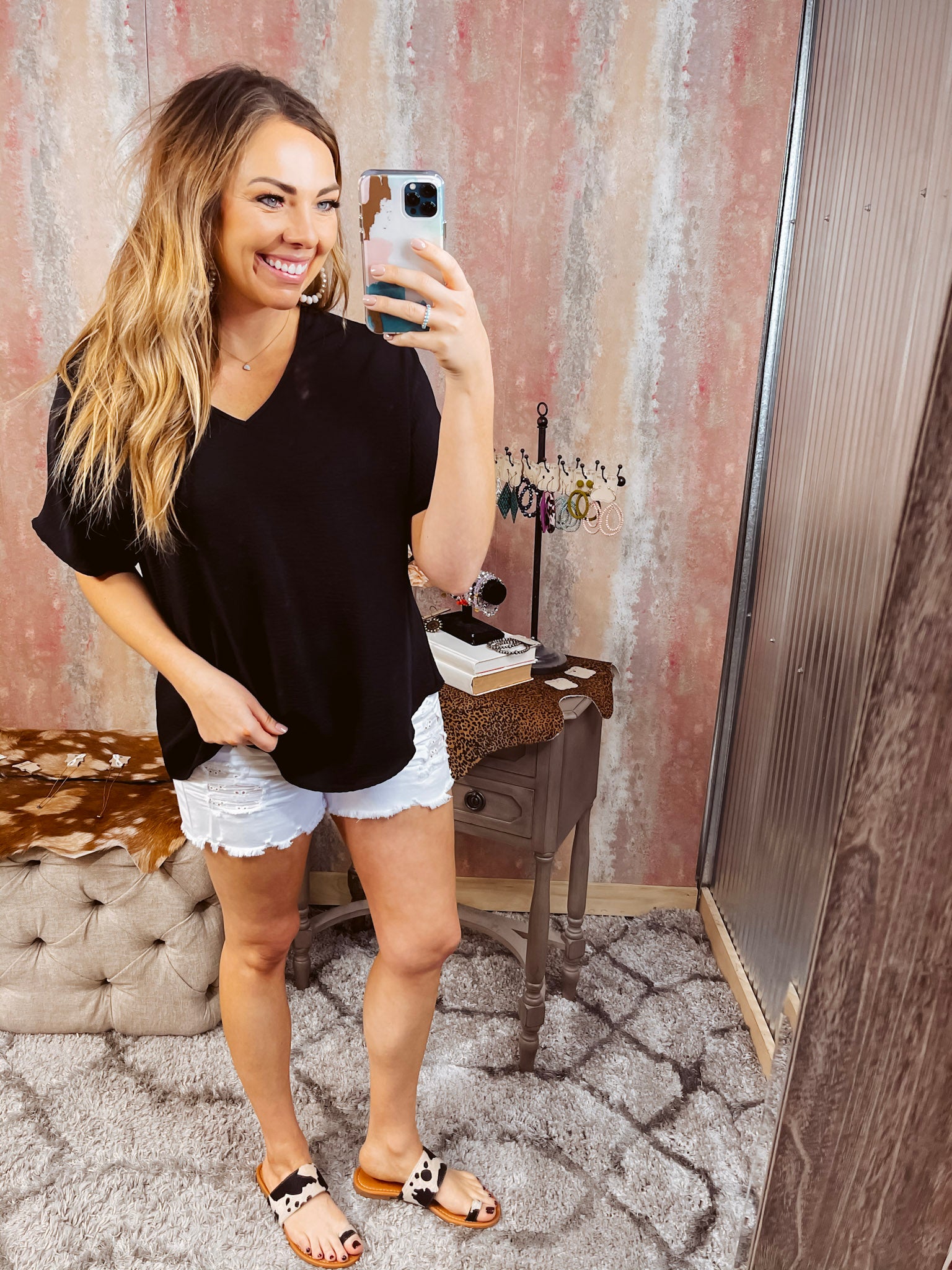 Lightweight and flowy black V neck dolman style short sleeved top.