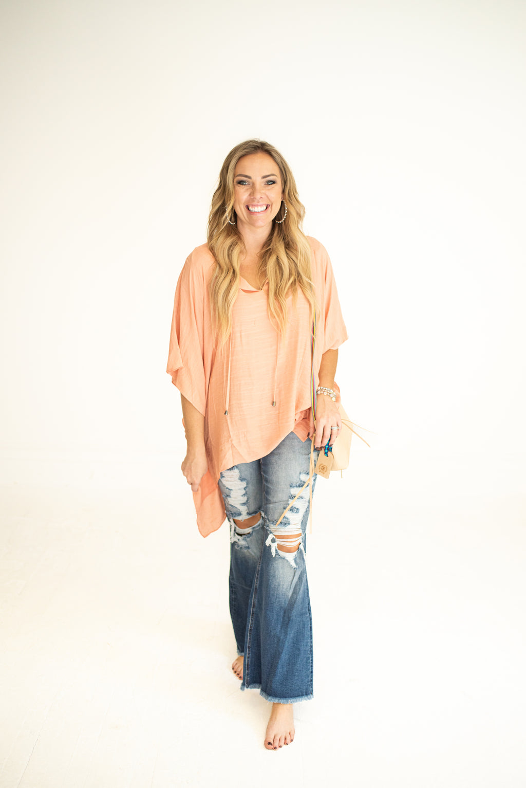 Medium Wash High Rise Distressed Flares